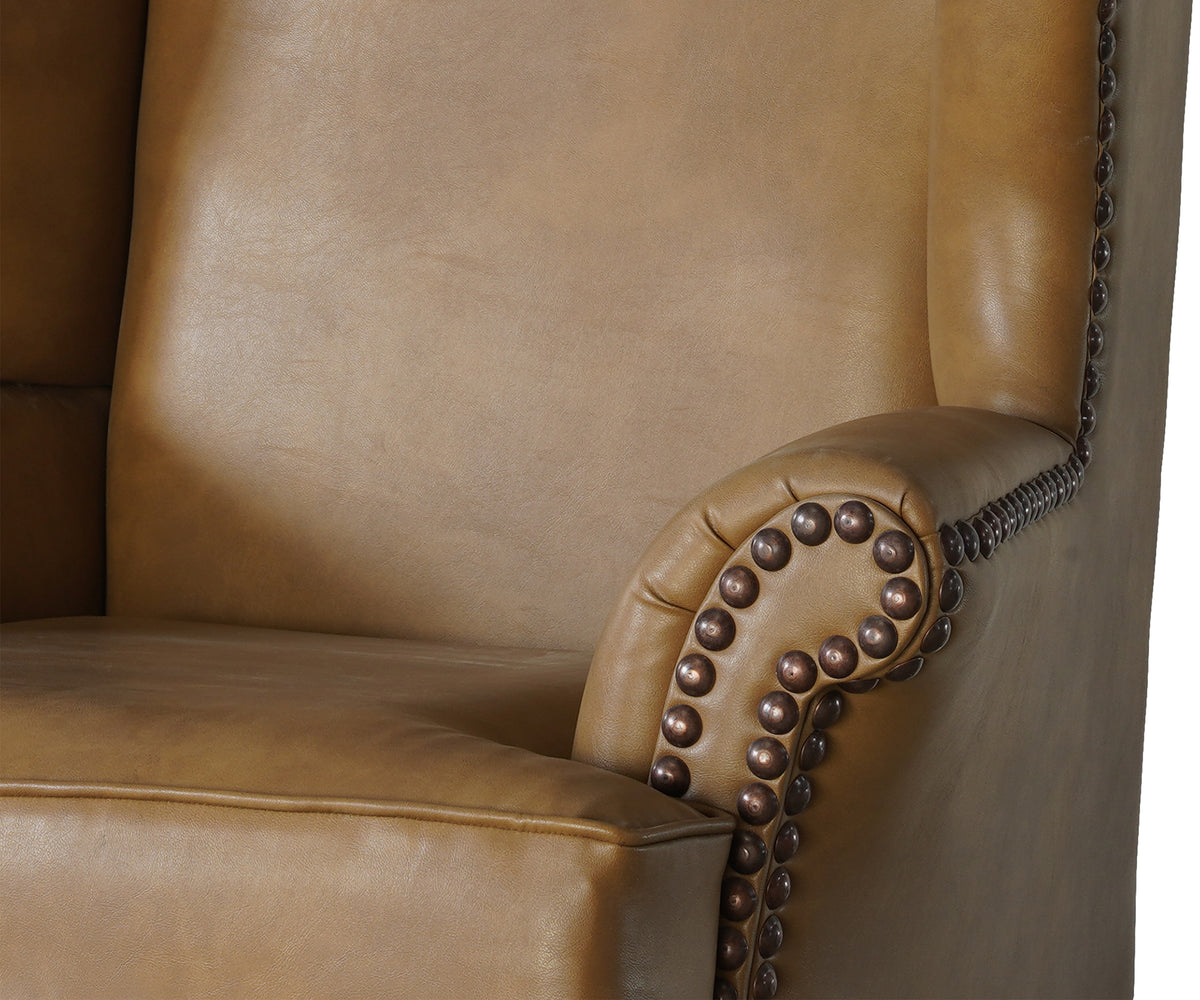 Tan Wingback Armchair with Cabriole Legs & Brasshead Trim